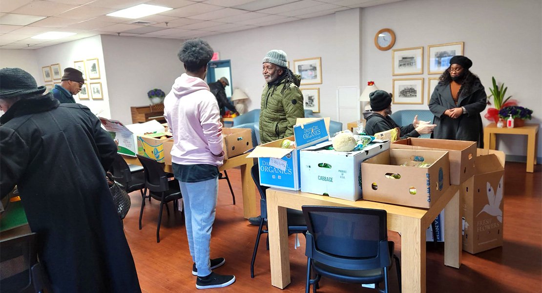 Volunteers getting boxes of food ready for donation