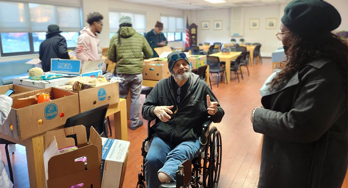 Chat with an Orange vet while getting boxes of food ready for donation